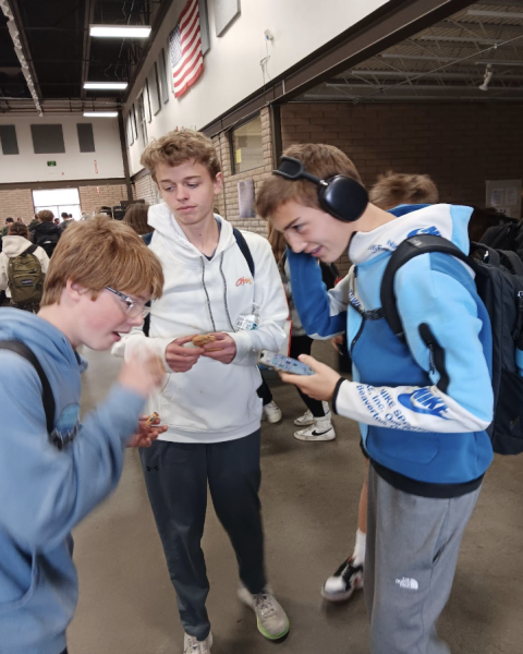 DHS students Keaton, Jude, and Dennis group up, talk, and laugh at FCA on the 30th of October in the fairgrounds building.
